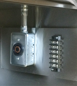 Low-voltage terminal block located in lower part of the box.